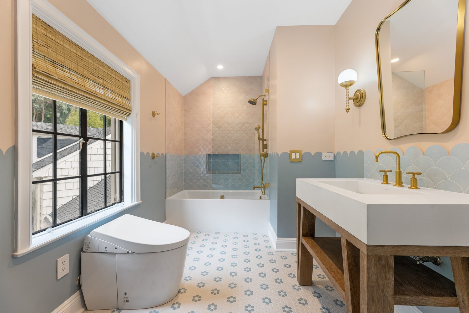 Pink and sage scalloped-tile bathroom in Pacific Palisades