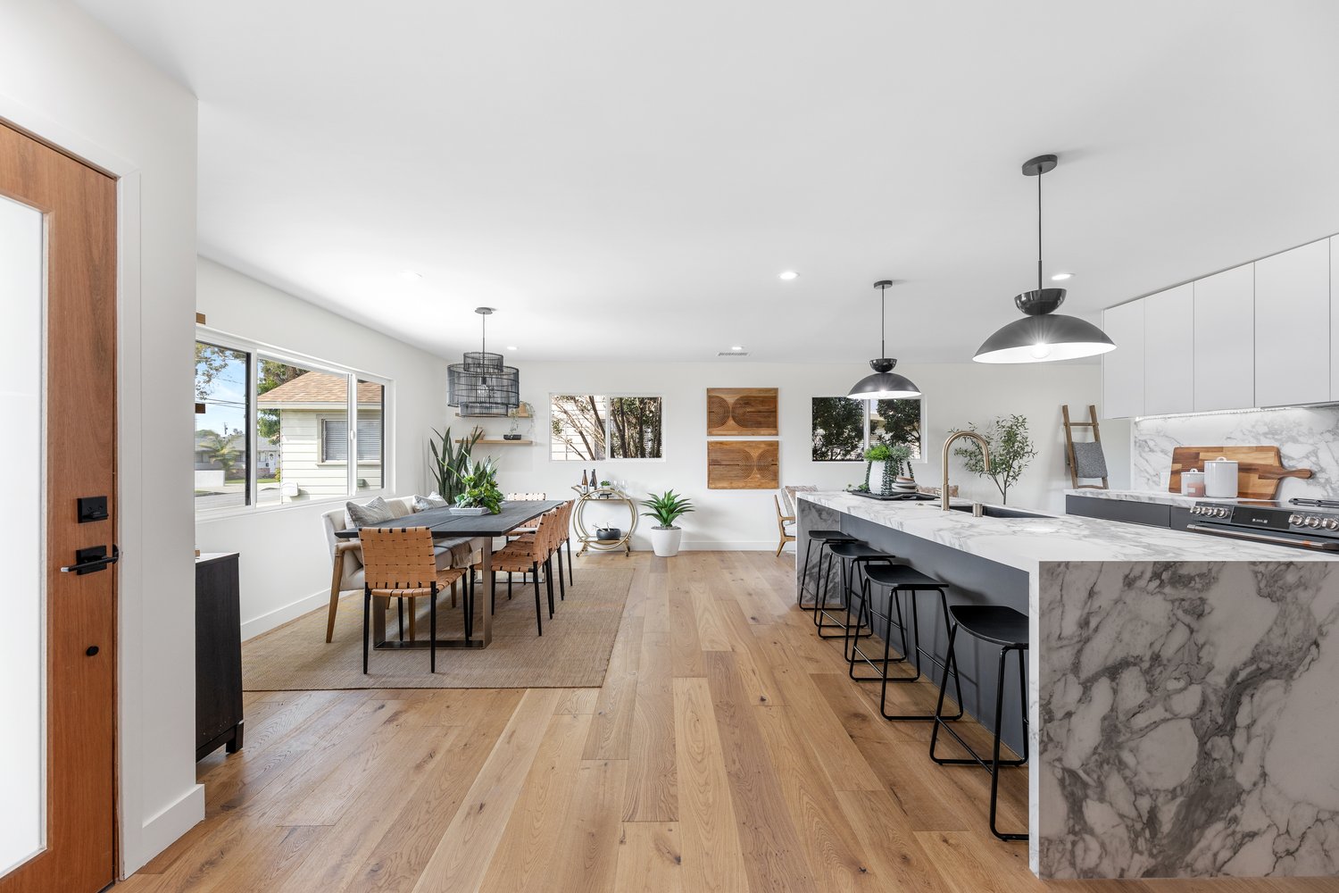 Open-plan kitchen with wood-slat wall in Torrance